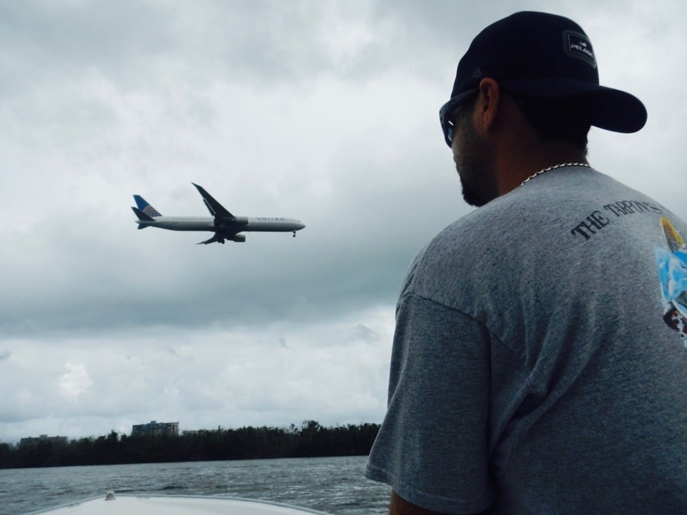 Angler fishes near the runway of international airport in San Juan, Puerto Rico