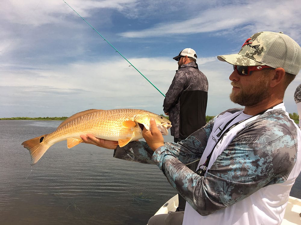 Capt. Cody Obiol and Bright Bronze Redfish