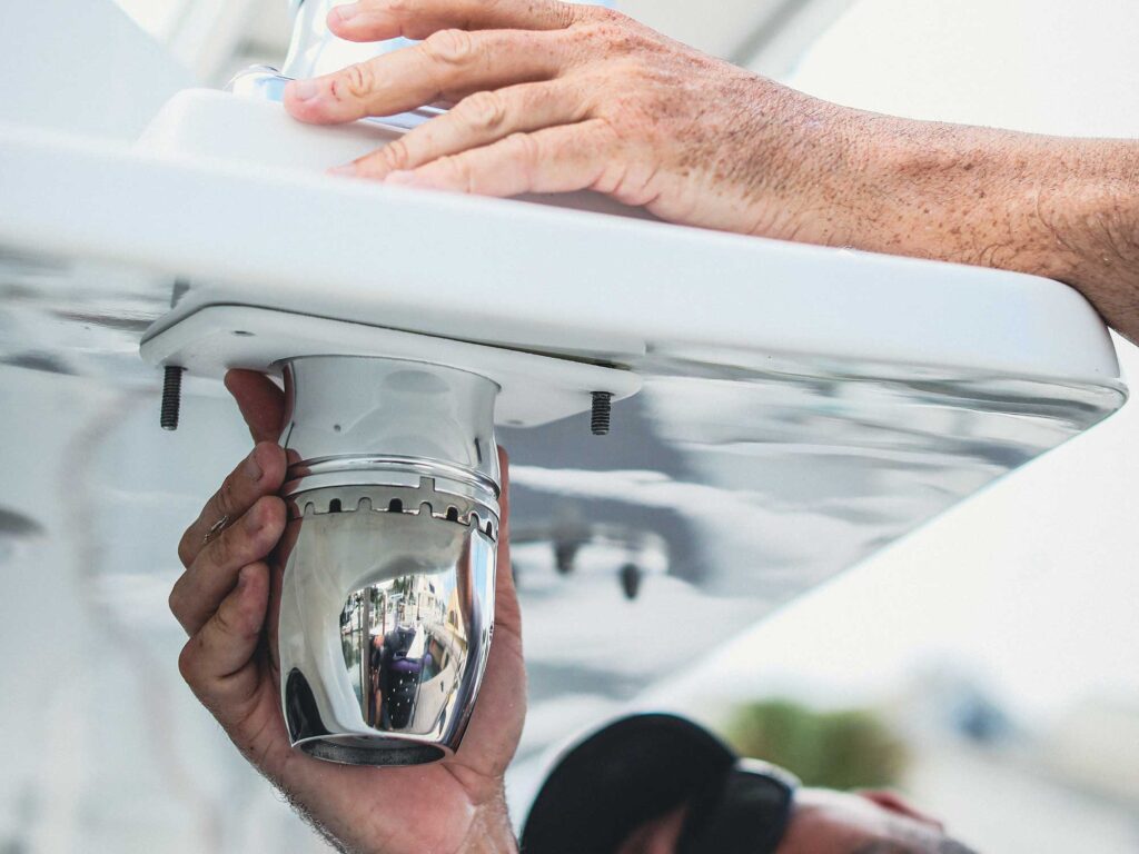 Installer adding boat accessories