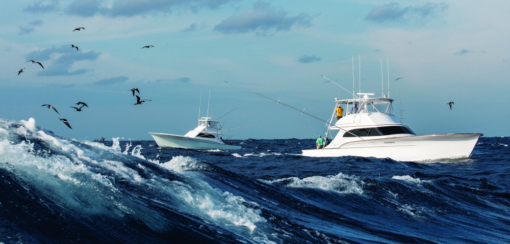 Large sport-fishers troll in very rough seas