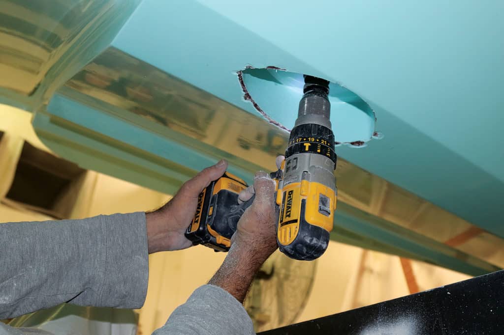 SeaVee technician works on flush-mounting an Airmar B275