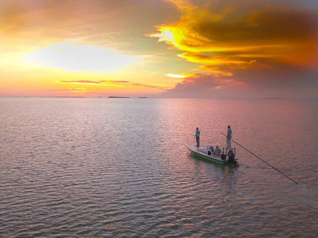 Xplor Boatworks X7 poling at sunrise