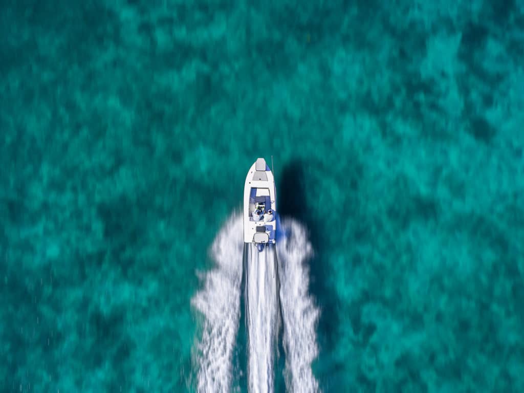 Skiff running fast over flats