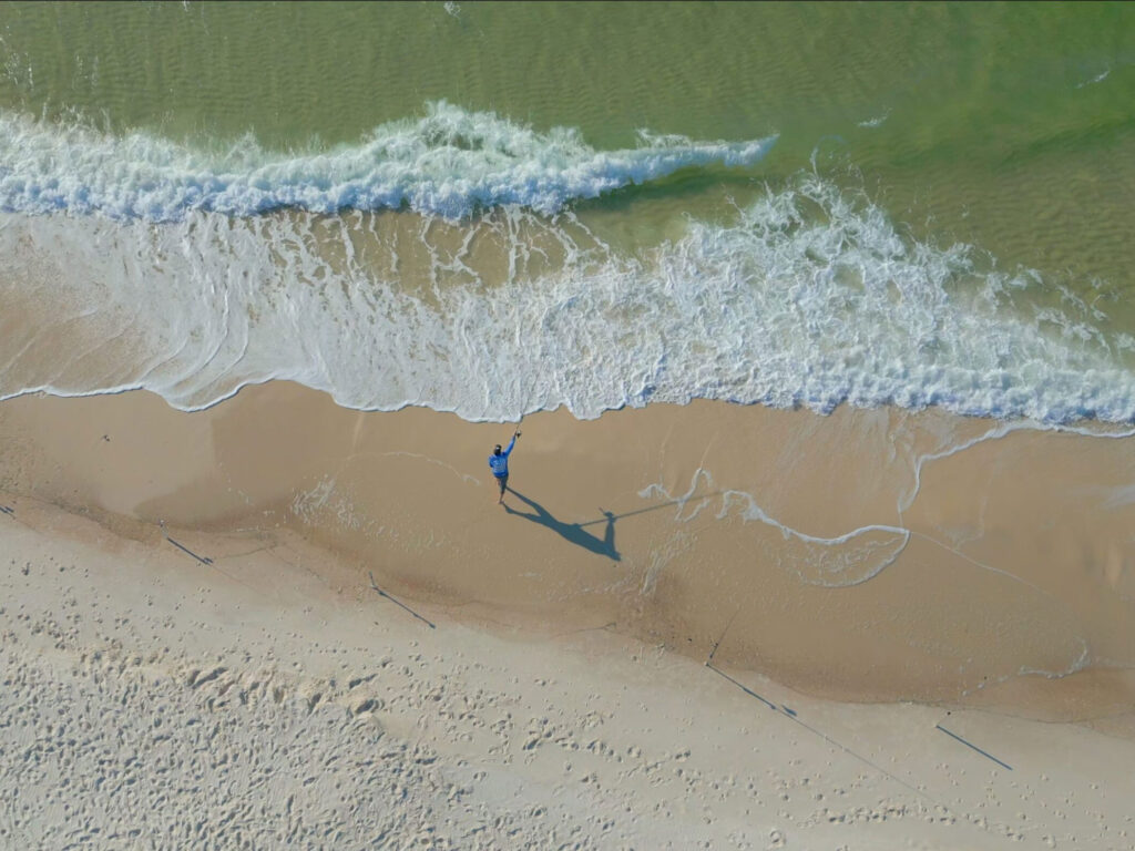 Angler casting from the beach