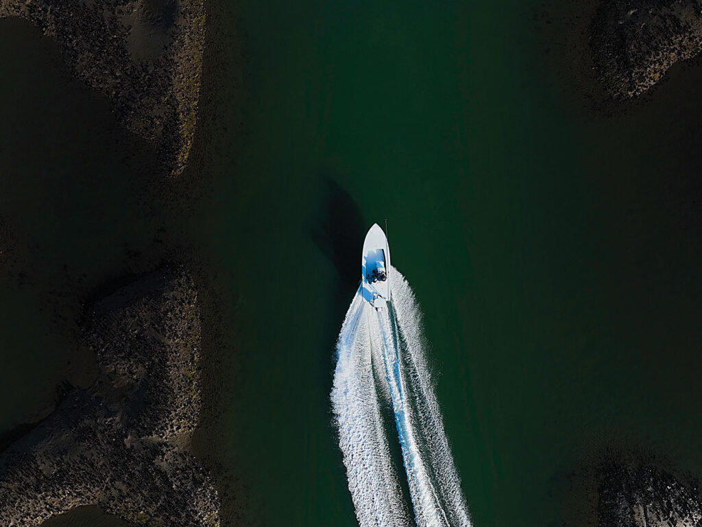 Skiff running around oyster beds